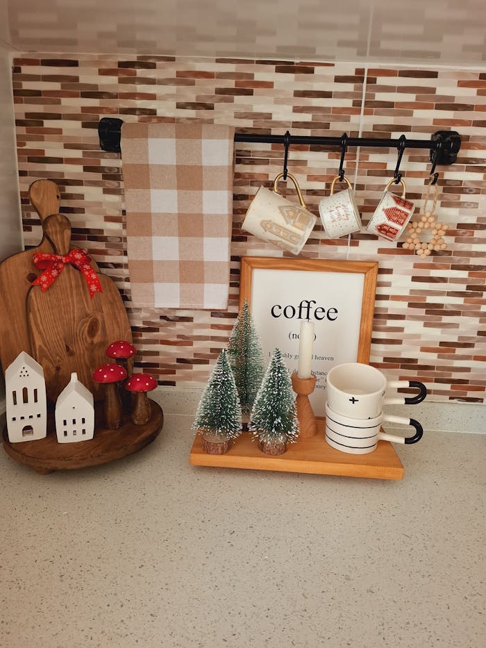 Festive kitchen corner with mugs, holiday decorations, and cozy elements.